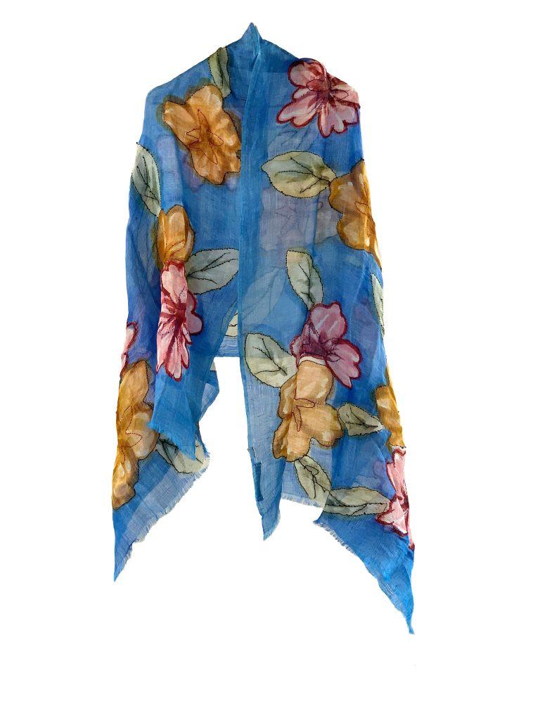 Delicate  scarf with flowers in blue colour  background